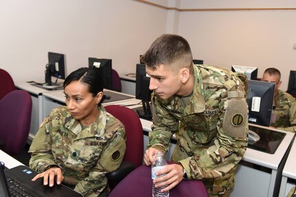 Second Lt. Seth Lionberger, right, Information Management Officer, 85th Support Command, provides instruction to Lt. Col. Vickie Argueta, equal opportunity officer, during a blackberry training class at the command's battle assembly weekend, Aug. 6, 2016. Blackberry devices were recently updated for section leaders as part of their lifecycle replacement. The lifecycle replacement assists with up-to-date security and a uniformed operating system across the formation.
(Photo by Spc. David Lietz)