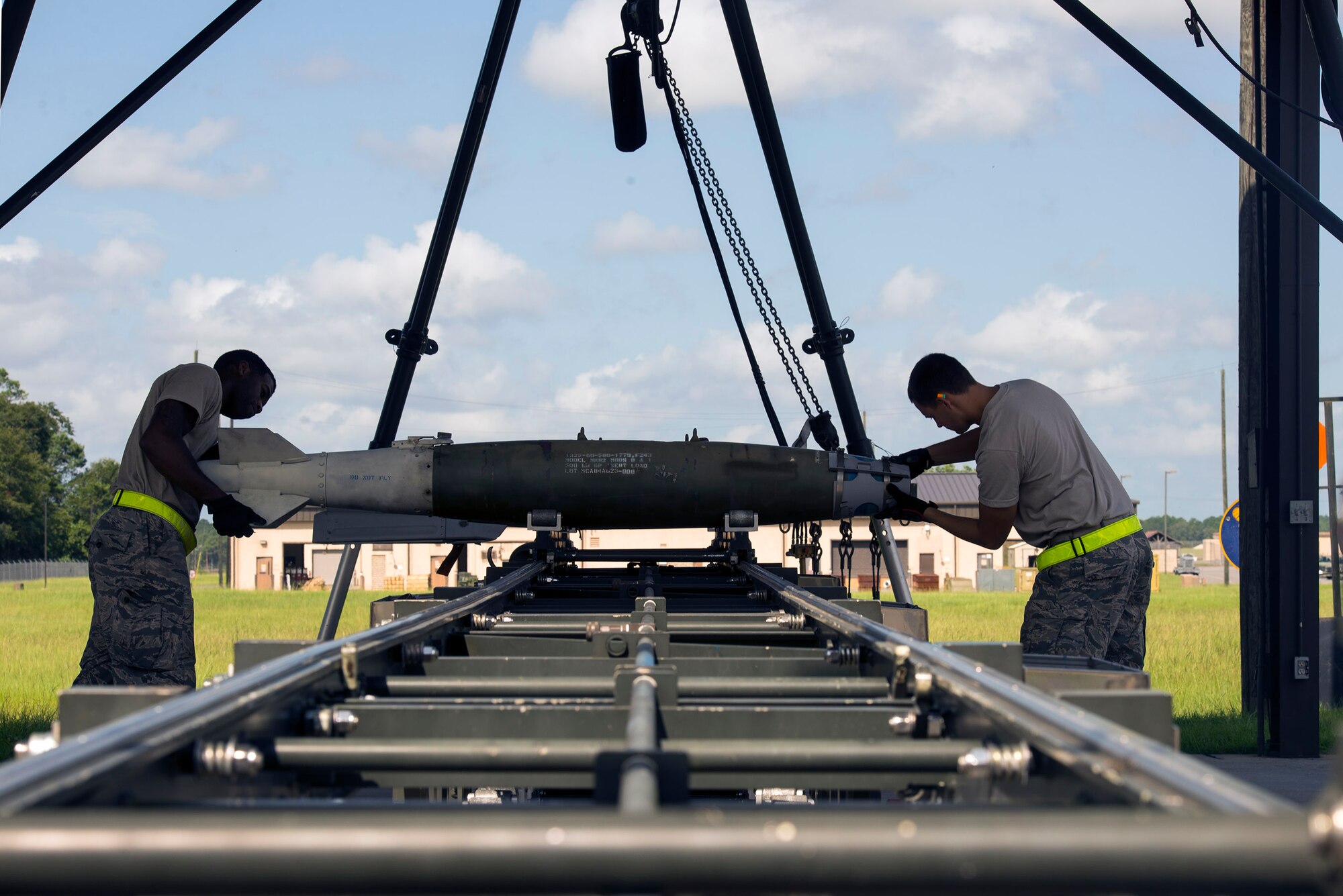U.S. Air Force Senior Airman Cadarius Woodard, left, and Airman Nick Klug, 23d Equipment Maintenance Squadron munitions flight conventional crew members, assemble an MK-82 practice bomb, Aug. 24, 2016, at Moody Air Force Base, Ga. The section’s munition stockpile has an approximate value of $44 million.
(U.S. Air Force photo by Airman 1st Class Greg Nash)
