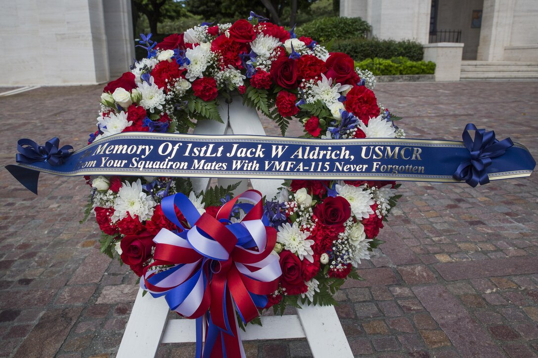 HONOLULU — A wreath bearing the name of 1st Lt. Jack Aldrich is displayed during a wreath laying ceremony, at the National Memorial Cemetery of the Pacific in Honolulu, July 29, 2016. Marines from Marine Fighter Attack Squadron 115, "Silver Eagles," paid tribute to Aldric who was  the first pilot killed from that squadron. With a long history of participating in almost every major conflict since their formation 73 years ago, VMFA-115 honored their fallen comrade. Marines from VMFA-115, stationed aboard Marine Corps Air Station Beaufort, S.C., were in Hawaii participating in the Rim of Pacific 2016 exercise, the largest maritime exercise in the world. In between aircraft maintenance and training, Marines remembered the legacy of Aldrich. (Marine Corps Photo by Lance Cpl. Jesus Sepulveda Torres)