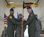 Lt. Col. Seth Spanier, right, 34th Expeditionary Bomb Squadron commander, accepts the 34th EBS guidon from Col. Samuel G. White III, 36th Operations Group commander, during a transfer of authority ceremony at Andersen Air Force Base, Guam, Aug. 15, 2016. The ceremony solidified the responsibility of the U.S. Pacific Command’s Continuous Bomber Presence being passed from the 69th EBS from Minot Air Force Base, N.D., to the 34th EBS from Ellsworth Air Force Base, S.D. 