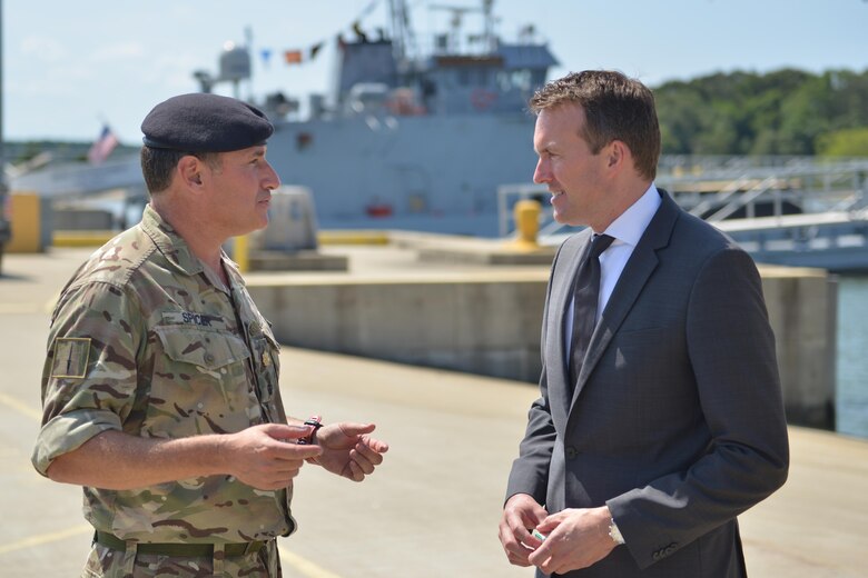 Eric Fanning, Secretary of the Army, speaks with British army Maj. Adrian Spicer, 7th Transportation Brigade (Expeditionary) operations department, at Fort Eustis, Va., Aug. 25, 2016. During his visit at Third Port, Fanning viewed two vessels as well as Army diving operations.  (U.S. Air Force photo by Staff Sgt. Natasha Stannard)