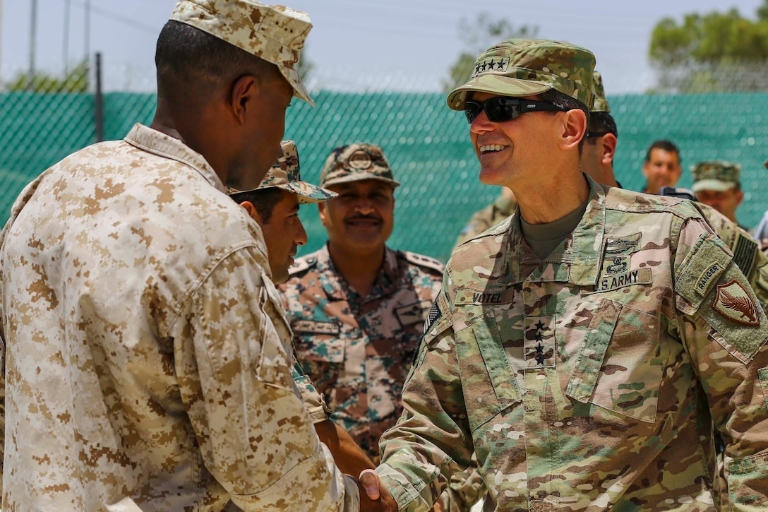 U.S. Army Gen. Joseph Votel Commander of U.S. Central Command, meets with U.S. Marine Sgt. Maj. Clifford Wiggins, Command Sgt. Maj. 5th Marine Expeditionary Brigade, and members of the Jordanian Armed Forces during Exercise Eager Lion 16 near Amman, Jordan on May 22, 2016. Eager Lion 16 is a US military bi-lateral exercise with the Hashemite Kingdom of Jordan designed to strengthen relationships and interoperability between partner nations. (U.S. Marine Corps photo by Cpl. Lauren Falk 5th MEB COMCAM/Released)