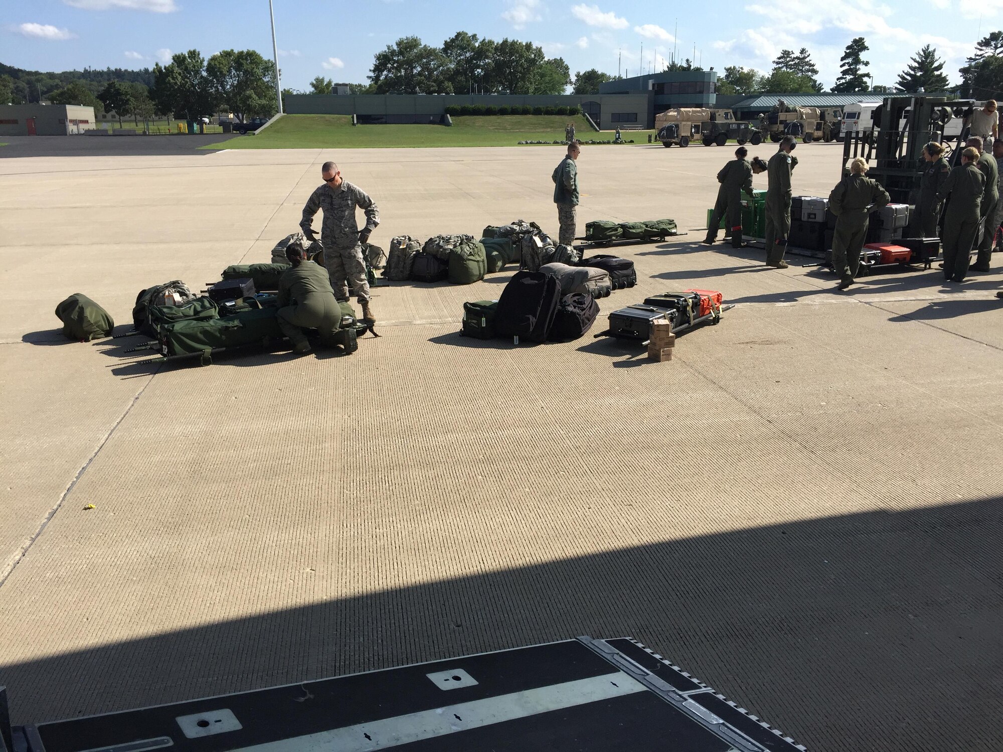 Aeromedical Evacuation Squadron members from the 446th Airlift ‘Rainier’ Wing organize equipment for the annual Patriot Warrior exercise at Fort McCoy, Wis., August 9. The squadron participated in Patriot Warrior, the Air Force Reserve Command’s largest field exercise. (Photo by Maj. Brooke Cortez)