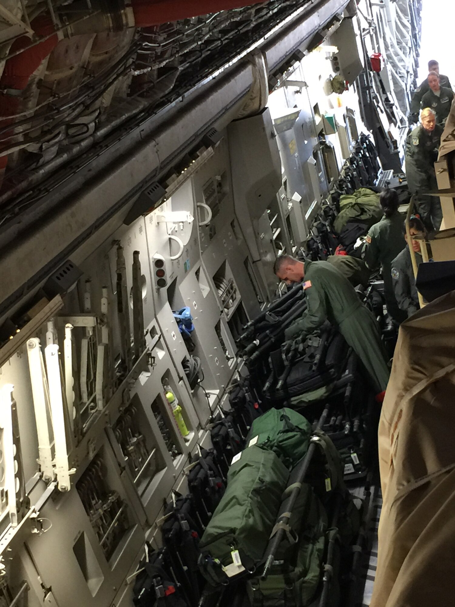 Members from the 446th Aeromedical Evacuation Squadron organize equipment loaded aboard a C-17 Globemaster III. The squadron participated in Patriot Warrior, the Air Force Reserve Command’s largest field exercise. (Photo by Maj. Brooke Cortez)