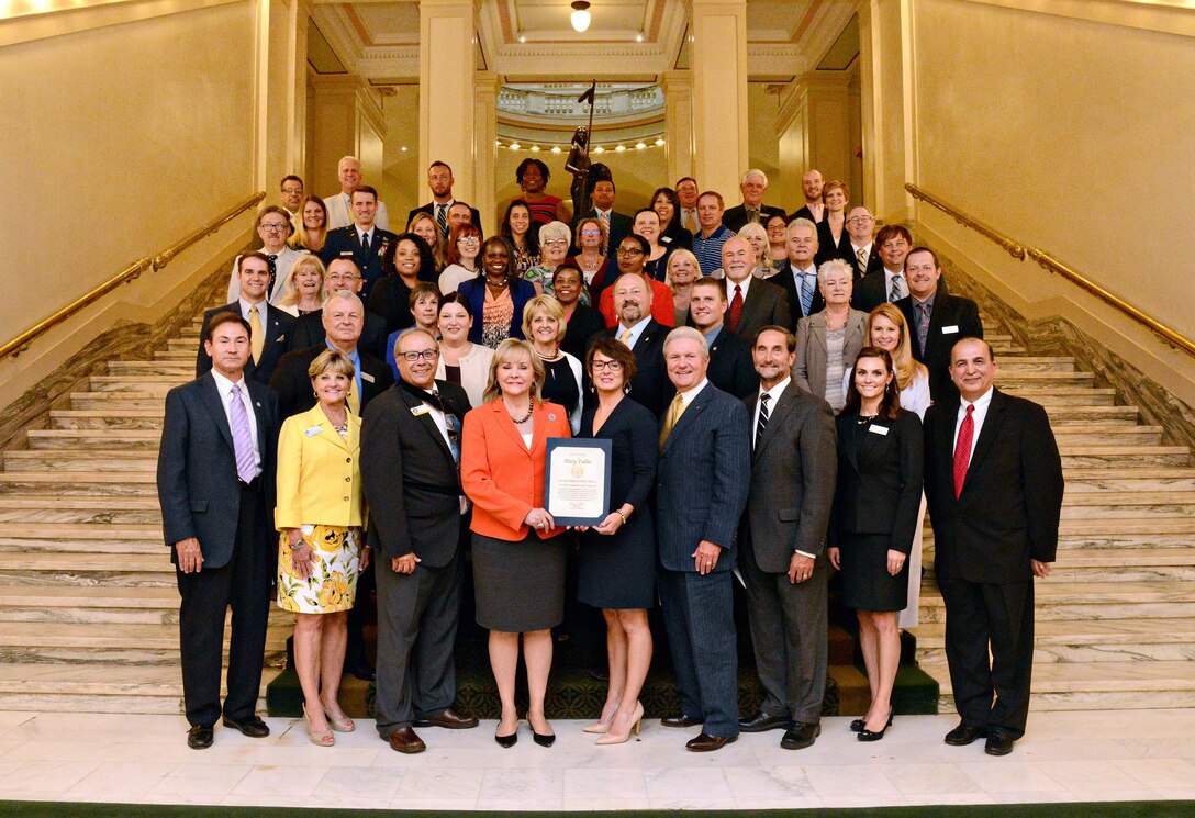 Gov. Mary Fallin presented a certificate to members and partners of the Central Oklahoma STEM Alliance (COSTEMA) during a Designation Ceremony at the State Capitol Aug. 8. Governor Fallin praised the members and local partners, including Tinker Air Force Base, for their initiatives implementing and advancing science, technology and mathematics programs throughout Oklahoma school districts and workforces. (Air Force photo by Kelly White)