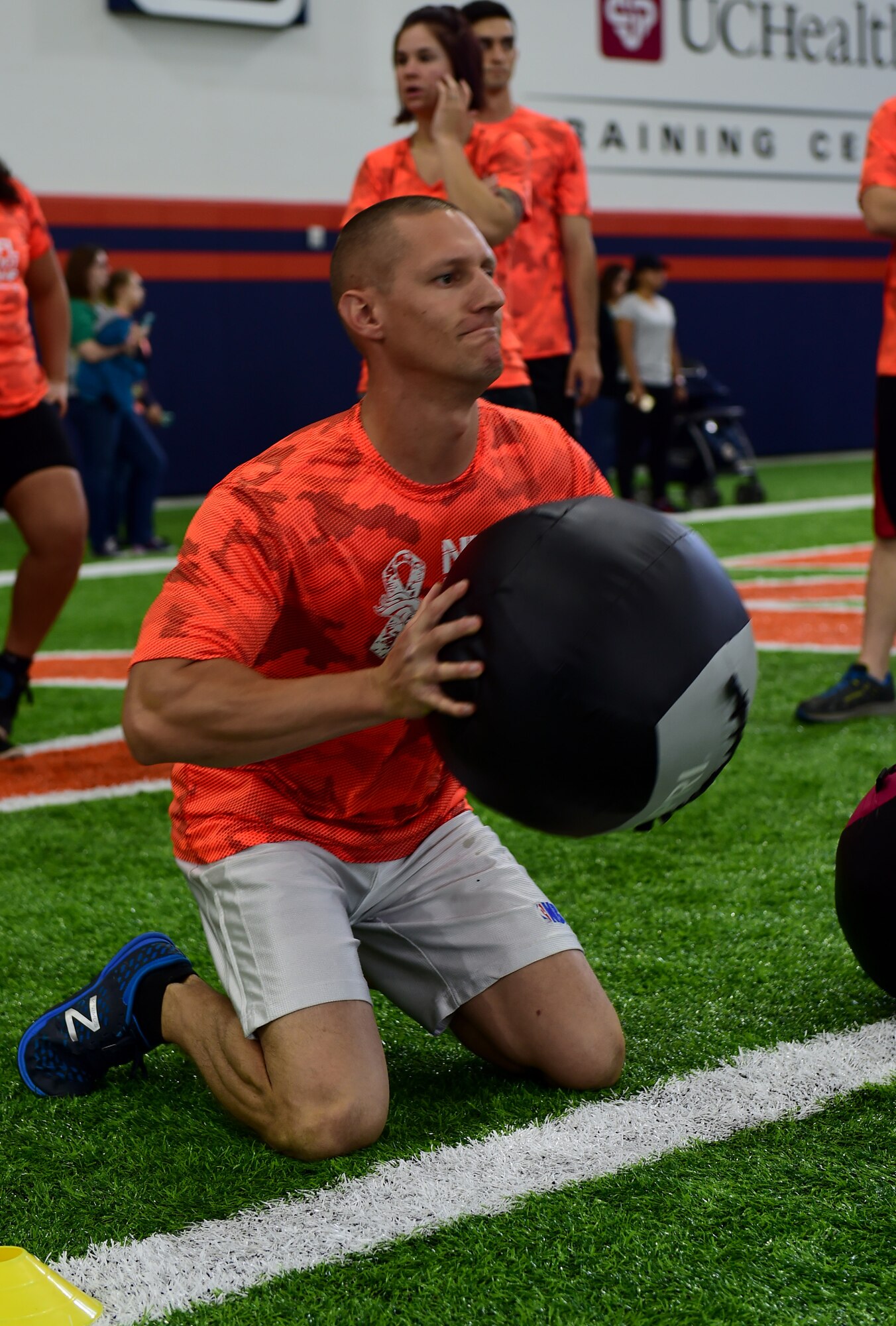 Staff Sgt. Matthew Campbell, 460th Medical Support Squadron logistics NCO in charge, throws a medicine ball during a kneeling power ball launch of a military training camp at the Denver Broncos’ University of Colorado Health Training Center Fieldhouse in Englewood, Colo., August 25, 2016. Team Buckley won the military camp competition after participating in five head-to-head challenges including: team ball catching, a gauntlet, tackling dummy relay, sled push and the kneeling power ball launch. (U.S. Air Force photo by Airman 1st Class Gabrielle Spradling/Released)