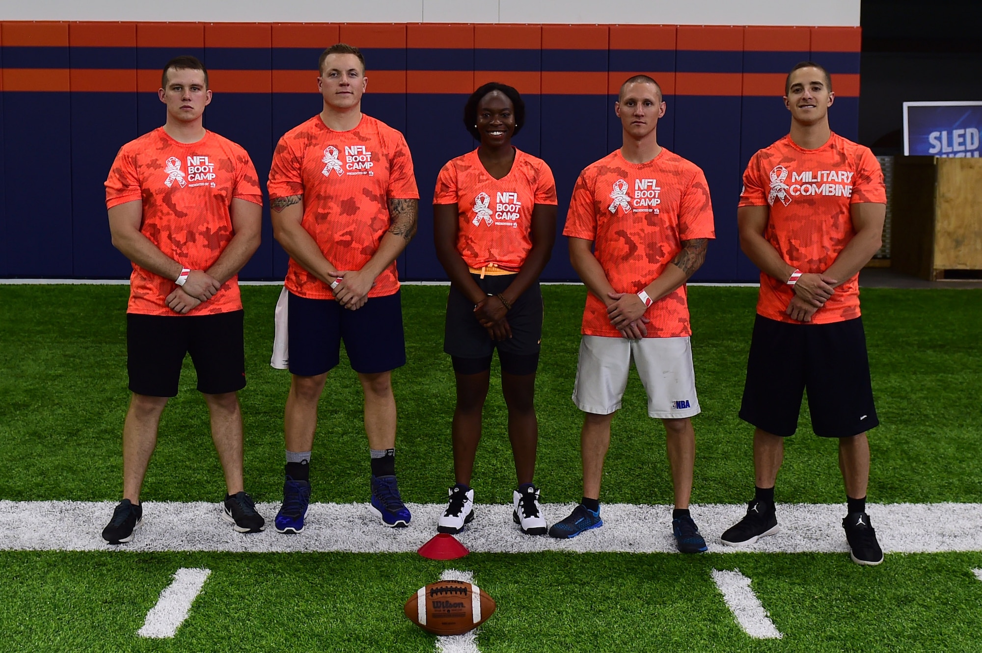 Team Buckley stands together during a military training camp at the Denver Broncos’ University of Colorado Health Training Center Fieldhouse in Englewood, Colo., August 25, 2016. The five-person team participated in five head-to-head skill challenges and won the overall competition. (U.S. Air Force photo by Airman 1st Class Gabrielle Spradling/Released)