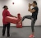 Senior Airman Emily Pearce, 11th Security Forces Squadron response force leader, delivers a kick to a bag held by Staff Sgt. Shandralekha Carlos, 11th Wing Commander's Action Group NCO in charge, during a Rape Aggression Defense class at Joint Base Andrews, Md., Aug. 20, 2016. The R.A.D. class is a self-defense program teaching basic self-defense tactice and avoidance techniques for risk factors. (U.S. Air Force photo by Airman 1st Class Rustie Kramer)