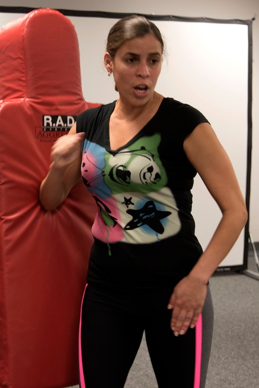 Senior Airman Darlena Vazquez Quinones, 11th Comptroller Squadron military pay technician, practices a high elbow jab during a Rape Aggression Defense class at Joint Base Andrews, Md., Aug. 20, 2016. The R.A.D. class is a self-defense program teaching basic self-defense tactics and avoidance techniques for risk factors. (U.S. Air Force photo by Airman 1st Class Rustie Kramer) 