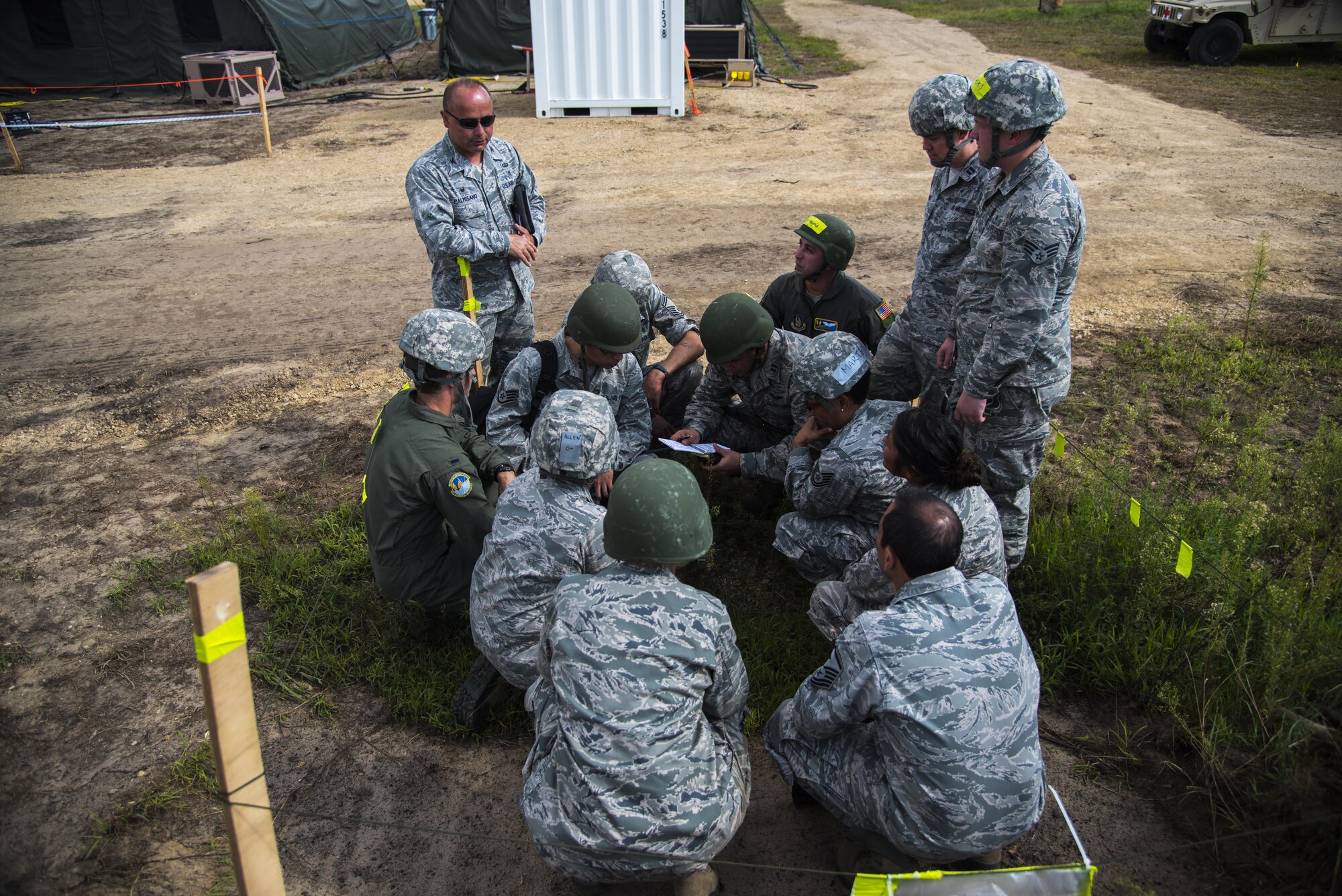 Col. Jim Palmisano, commander, 45th Aeromedical Evacuation Squadron, gives feedback to team participating in Patriot Warrior exercise August 18, 2016, at Fort McCoy, Wis. Patriot Warrior is the Air Force Reserve's premier contingency deployment training exercise, designed to demonstrate training ranging from bare base buildup to full operational capabilities. (U.S. Air Force photo by Staff Sgt. Adam C. Borgman)