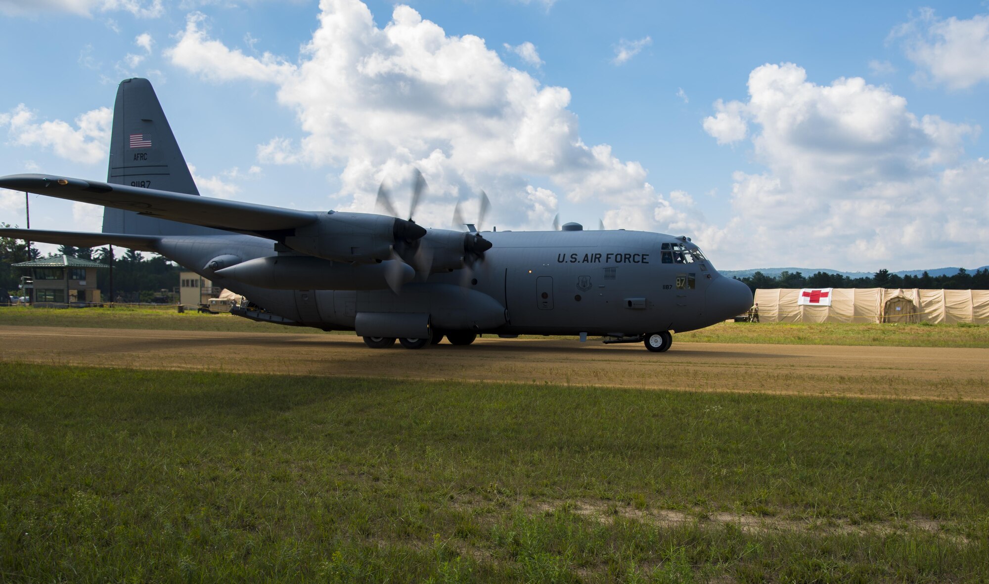 A C-130 Hercules lands in support of Patriot Warrior exercise August 18, 2016, at Fort McCoy, Wis. Patriot Warrior is the Air Force Reserve's premier contingency deployment training exercise, designed to demonstrate training ranging from bare base buildup to full operational capabilities. (U.S. Air Force photo by Staff Sgt. Adam C. Borgman)