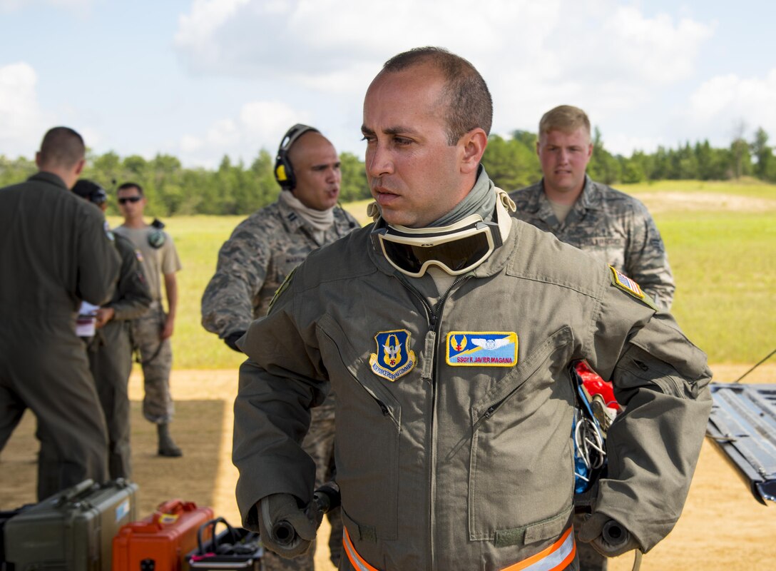 Staff Sgt. Javier Magana, 45th Aeromedical Evacuation Squadron, carries patient litter onto C-130 (not shown) in support of Patriot Warrior exercise August 18, 2016, at Fort McCoy, Wis. Patriot Warrior is the Air Force Reserve's premier contingency deployment training exercise, designed to demonstrate training ranging from bare base buildup to full operational capabilities. (U.S. Air Force photo by Staff Sgt. Adam C. Borgman)