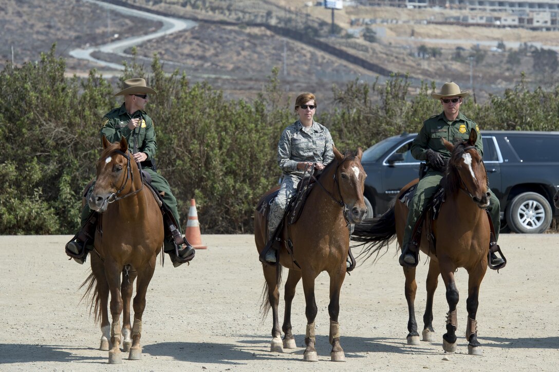 Gen. Lori Robinson, NORAD and USNORTHCOM Commander, is briefed on the Southwest Border Region via horseback with the U.S. Customs and Border Protection along the border near San Diego, Calif., Aug. 24, 2016.