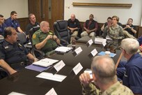 Gen. Lori Robinson (back center), NORAD and USNORTHCOM Commander, is briefed about the Southwest Border Region by members of the Department of Homeland Security, the U.S. Customs and Border Protection and Joint Task Force North at the CBP Air and Marine Operations in San Diego, Calif., Aug. 24, 2016.
