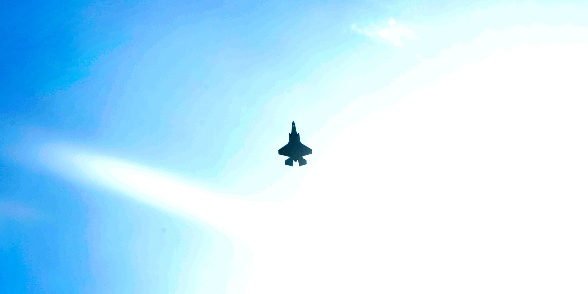 The Air Force’s 100th F-35 Lightning II flys across the sun over Luke Air Force Base, Ariz, on Aug. 26, 2016. The aircraft, designated AF-100, marks a milestone for the F-35 program as it continues to grow, progress and support initial operational capabilities. (U.S. Air Force photo by Staff Sgt. Marcy Copeland)
