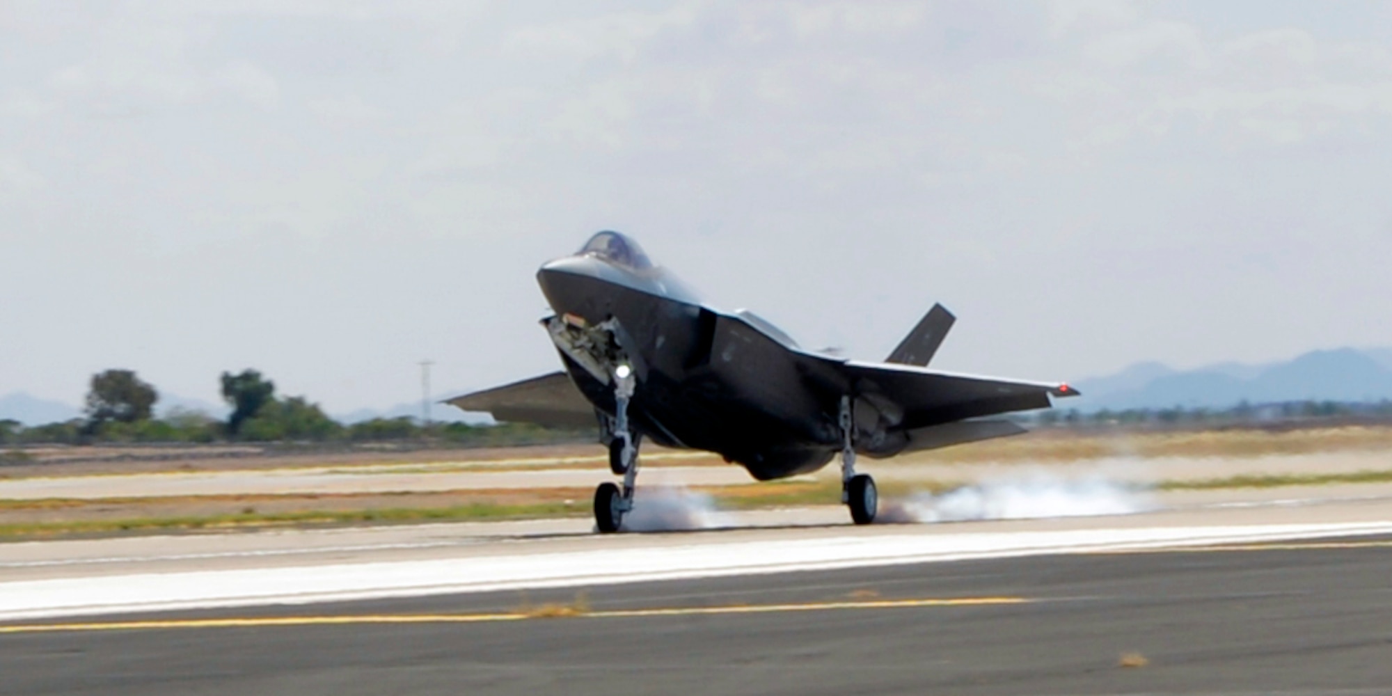 The Air Force’s 100th F-35 Lightning II lands atr Luke Air Force Base, Ariz, on Aug. 26, 2016. The aircraft, designated AF-100, marks a milestone for the F-35 program as it continues to grow, progress and support initial operational capabilities. (U.S. Air Force photo by Staff Sgt. Marcy Copeland)
