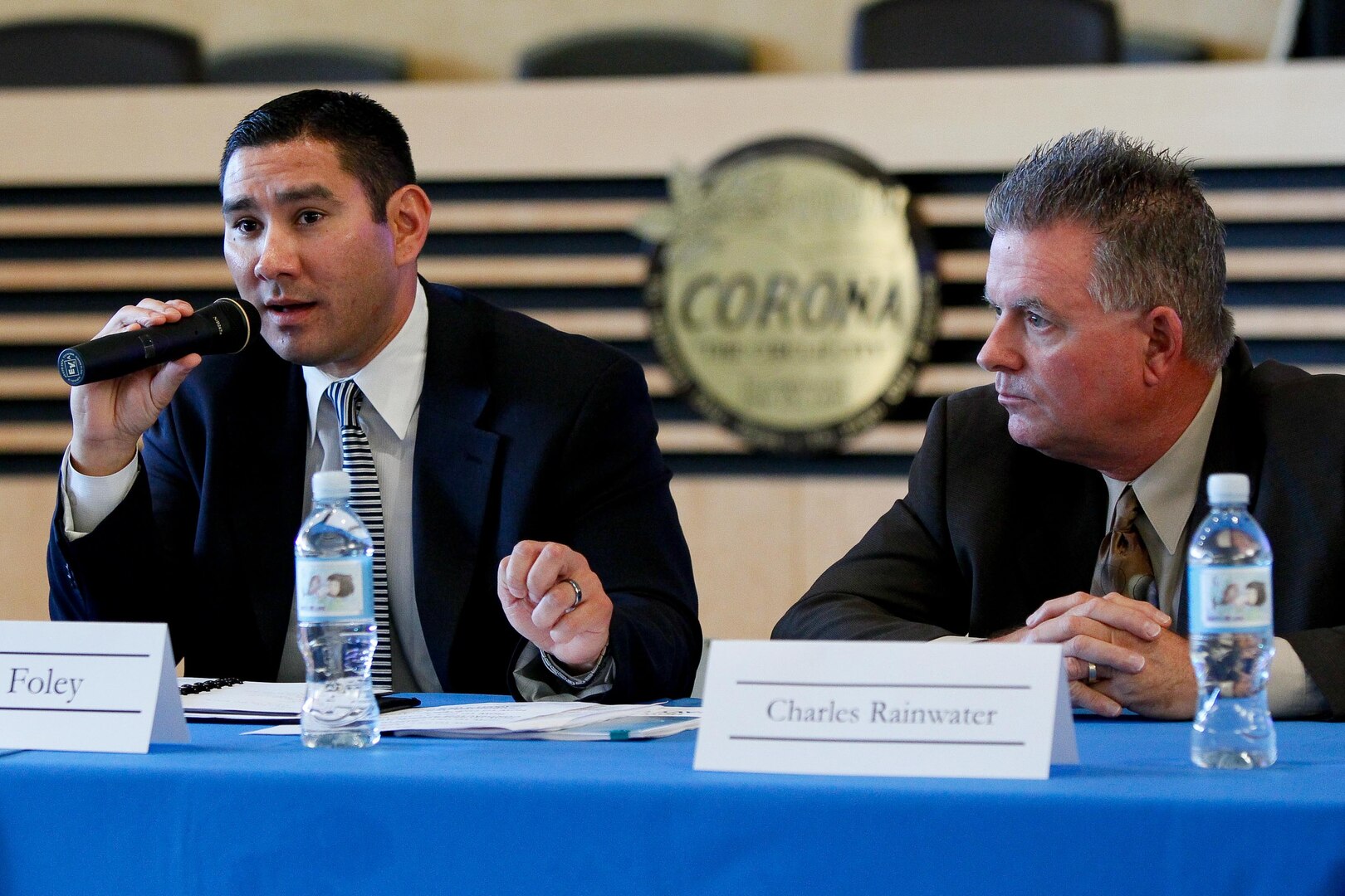 NSWC Corona Division Command Contracts Manager Sean Foley, left, and Contracting Officer Charles Sam Rainwater participate in "Doing Business with the Government" program at Corona City Hall.  Event organized as panel discussion to give small business owners insight into specific procurement procedures of City of Corona and other local government agencies. 
