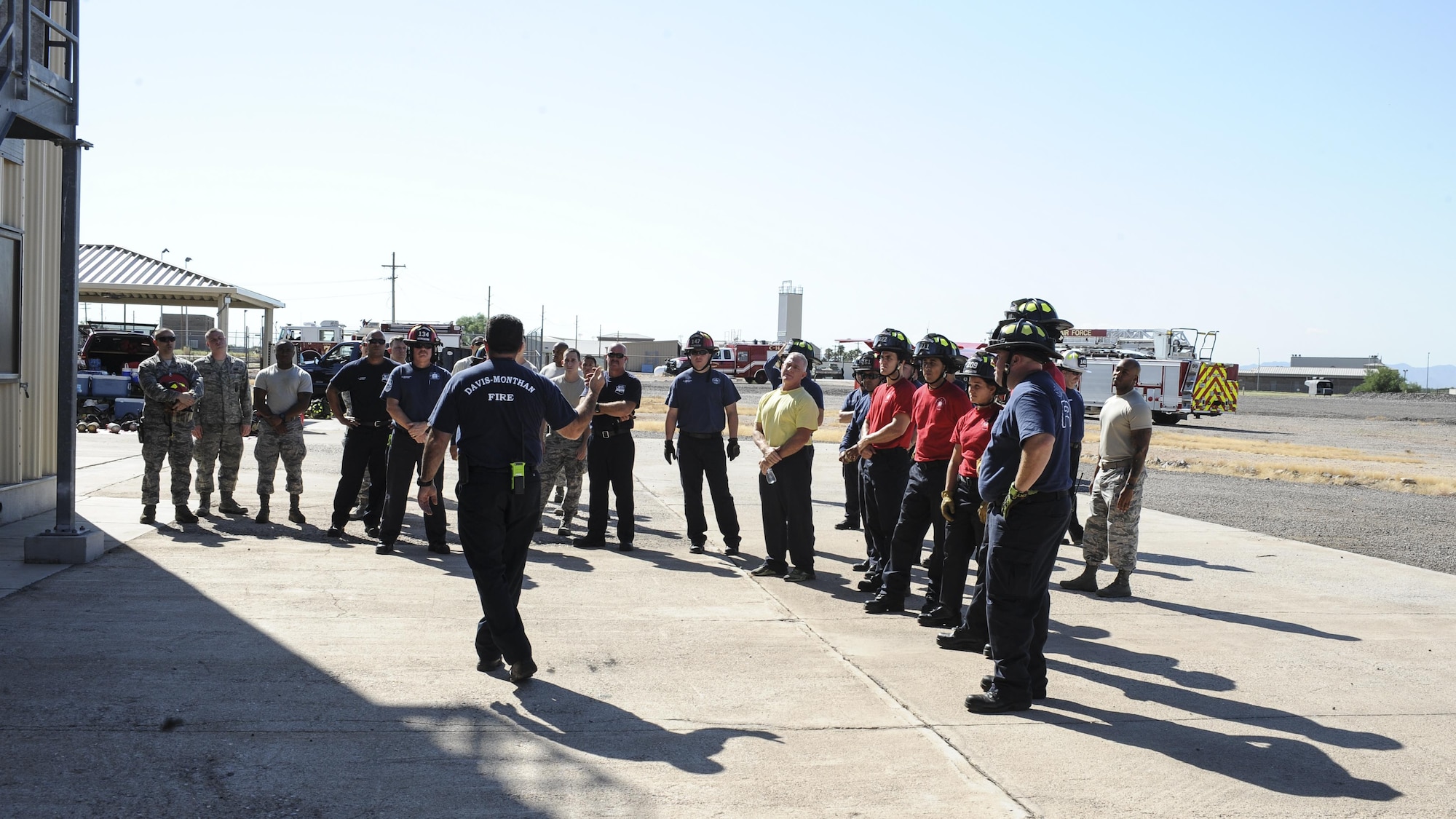 Darren Felish, 355th Civil Engineer Squadron assistant chief of training, briefs D-M and Green Valley firefighters before live-fire training at Davis-Monthan Air Force Base, Ariz., Aug. 24, 2016. Members of the 355th CES’s Fire and Emergency Services and the Green Valley Fire District participated in live-fire Class A training over the course of four days on D-M AFB’s fire training grounds. (U.S. Air Force photo by Airman 1st Class Mya M. Crosby)