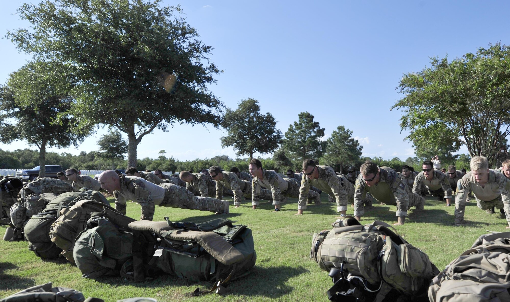 Special Tactics Airmen from the 24th Special Operations Wing perform memorial push ups in honor of Staff Sgt. Forrest Sibley Aug. 26, 2016, at Naval Air Station Pensacola, Fla., on the first annivesary of his death. He and another Special Tactics Airman, Capt. Matthew D. Roland, were killed in action in Afghanistan last year. (U.S. Air Force photo by Tech. Sgt. Tyler Placie)
