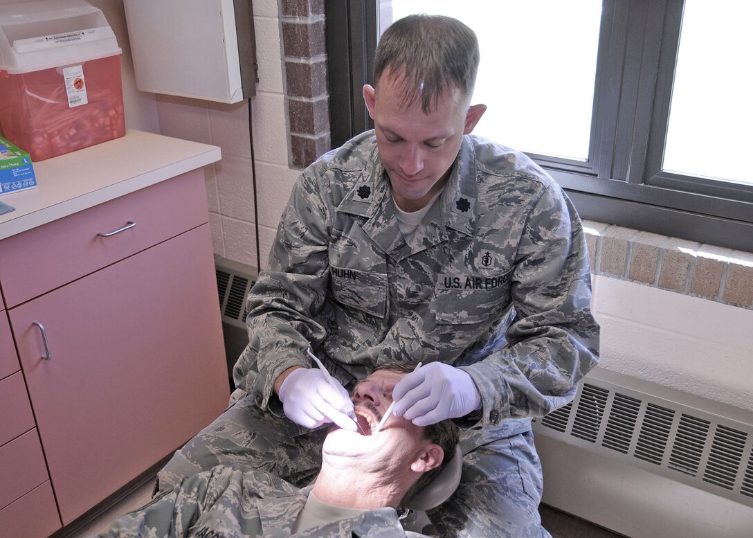 Lt. Col. Adam Huhn, 120th Medical Group dentist, performs a dental exam of Tech. Sgt. Jake Jacobs, 120th Airlift Wing fuel systems technician, at the 120th Airlift Wing, Great Falls, Mont., Aug. 17, 2016. The 120th Medical Group received the highest score during an inspection by the National Guard Bureau Joint Surgeon’s Office. (U.S. Air National Guard photo by Staff Sgt. Lindsey Soulsby/Released)