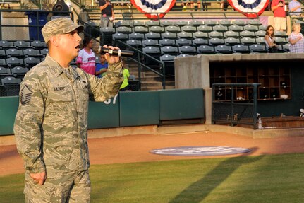 Master Sgt. Jason Gilbert, 628th Medical Operations Squadron superintendent, sings the national anthem during Military Appreciation Night, Aug. 24, 2016 at Joseph P. Riley Jr. Park in Charleston, S.C. The Charleston RiverDogs baseball team host military appreciation nights to show their support for the local military. (U.S. Air Force photo/Tech. Sgt. Renae Pittman)
