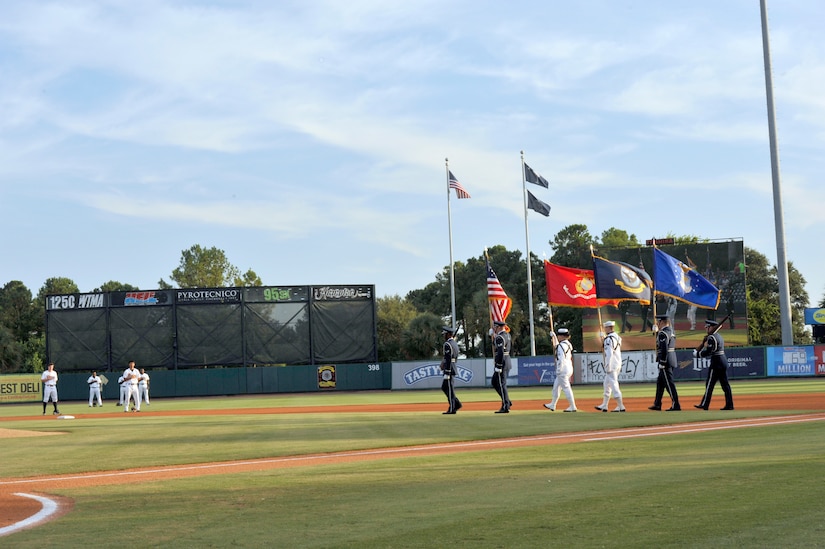 The Joint Base Charleston Honor Guard presents the colors prior to Military Appreciation Night at the Joseph P. Riley, Jr. Park in Charleston, S.C. The Charleston RiverDogs baseball team hold military appreciation nights throughout the season to show support and gratitude to local military members. (U.S. Air Force photo/Tech. Sgt. Renae Pittman)