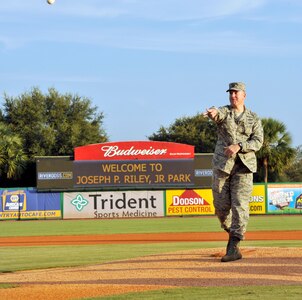 U.S. Air Force Col. Robert Lyman, Joint Base Charleston commander, throws the first pitch kicking off  Military Appreciation Night Aug. 24,2016, at Joseph P. Riley, Jr. ark in Charleston, South Carolina. The Charleston RiverDogs baseball team host military appreciation nights to show gratitude to local military members. (U.S. Air Force photo/Tech. Sgt. Renae Pittman)
