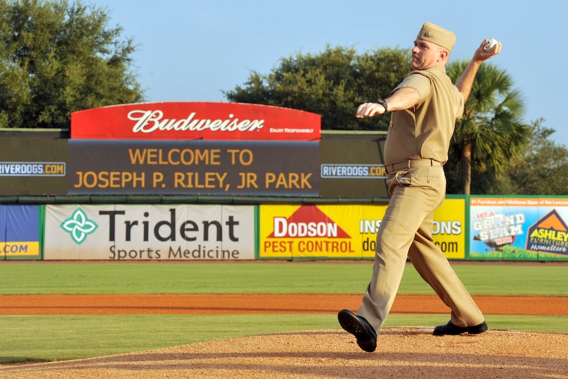 U.S. Navy Capt. Tony Lott, commanding officer of the Naval Nuclear Power Training Unit of Joint Base Charleston, throws the ceremonial first pitch at Joseph P. Riley Jr. Park for a RiverDogs baseball game, Aug. 24, 2016, Charleston, South Carolina. The Military Appreciation Night featured the Joint Base Charleston Honor Guard, the singing of the national anthem, and JB Charleston leadership throwing the first pitches to kick off the night. (U.S. Air Force photo/Tech. Sgt. Renae Pittman)