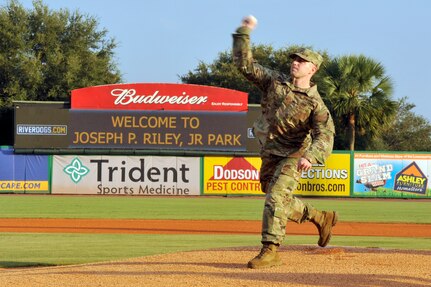 U.S. Army Maj. Jason Legro, deputy commander for the U.S. Army Corps of Engineers, Charleston District, throws the first pitch at a Charleston Riverdogs baseball game, Aug. 24, 2016, Charleston, South Carolina. The Military Appreciation Night featured the Joint Base Charleston Honor Guard, the singing of the national anthem, and JB Charleston leadership throwing ceremonial first pitches to kick off the night. (U.S. Air Force photo/Tech. Sgt. Renae Pittman)