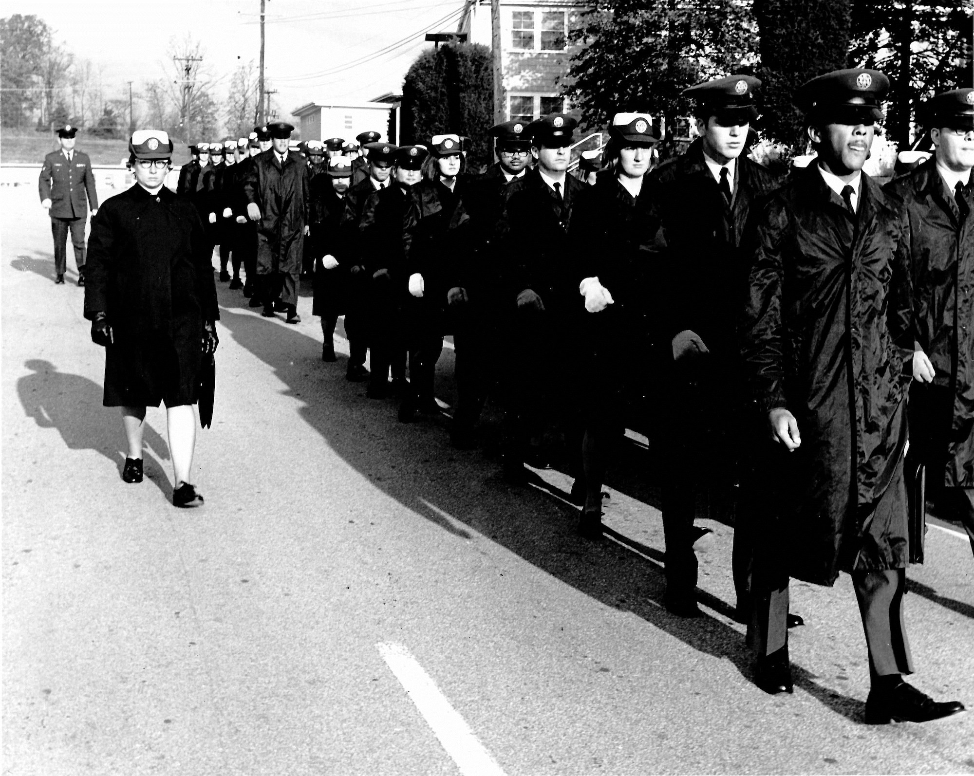 A female Airman leads the formation of Noncommissioned Officer Leadership School 71-2 L, with 22 Women in the Air Force, or WAFs, in 1970 at the I.G. Brown Training and Education Center on McGhee Tyson Air National Guard Base in Louisville, Tenn. (U.S. Air Force file photo)