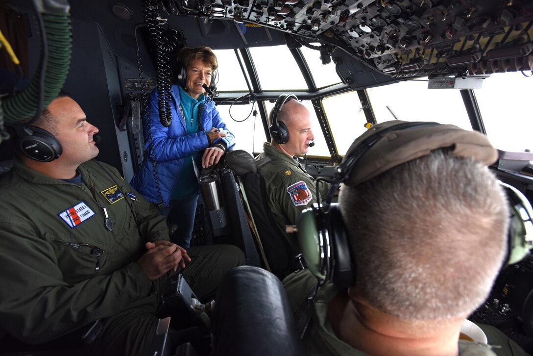 U.S. Senator Lisa Murkowski speaks with U.S. Coast Guard Cmdr. Nahashon Almondmoss (right) and Lt. Cmdr Mike Angeli (middle-right) in route to Kotzebue, Alaska aboard a USCG C-130 Aug. 24, 2016. More than 60 distinguished visitors flew to Kotzebue to observe Exercise Arctic Chinook, which is a joint USCG and U.S. Northern Command-sponsored exercise on the U.S. State Department approved list of Arctic Council Chairmanship events. The Arctic mass rescue operation exercise scenario consisted of an adventure-class cruise ship with approximately 200 passengers and crew that experience a catastrophic event with the need to abandon ship. Arctic Chinook exercised elements of the Arctic Search and Rescue Agreement to include interoperability, cooperation, information sharing, SAR services, and joint exercise review. 