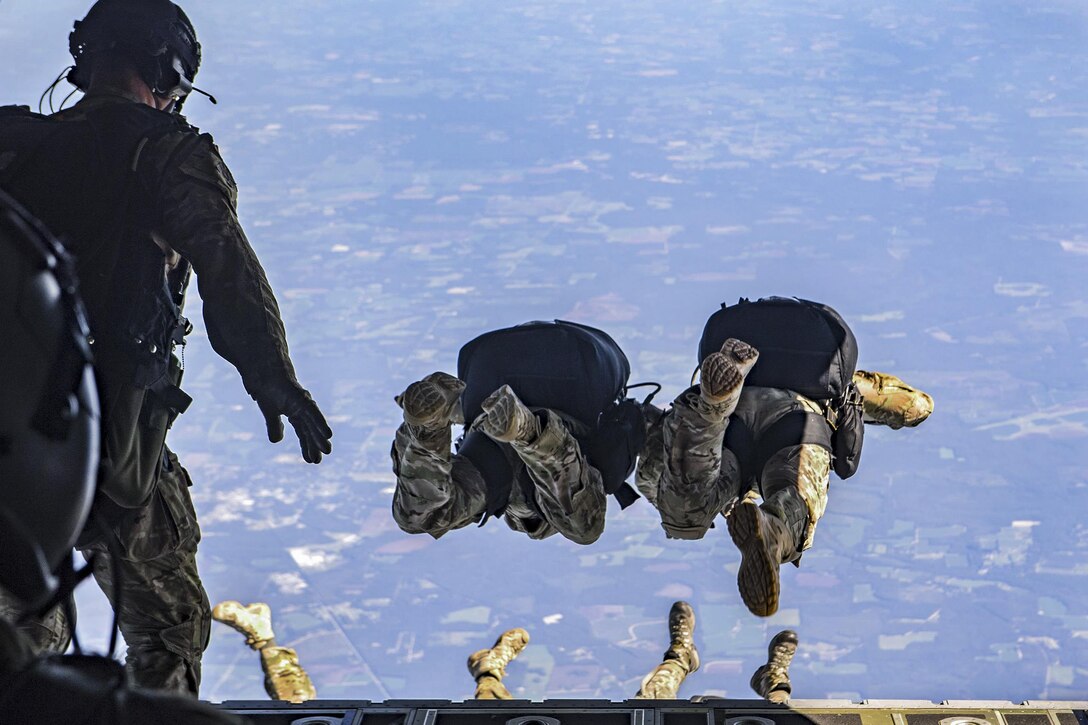 Air Force pararescuemen jump from an HC-130J Combat King II aircraft 25,000 feet over Moody Air Force Base, Ga., Aug. 18, 2016. Pararescuemen are qualified experts in airborne and military free-fall operations. Air Force photo by Staff Sgt. Ryan Callaghan