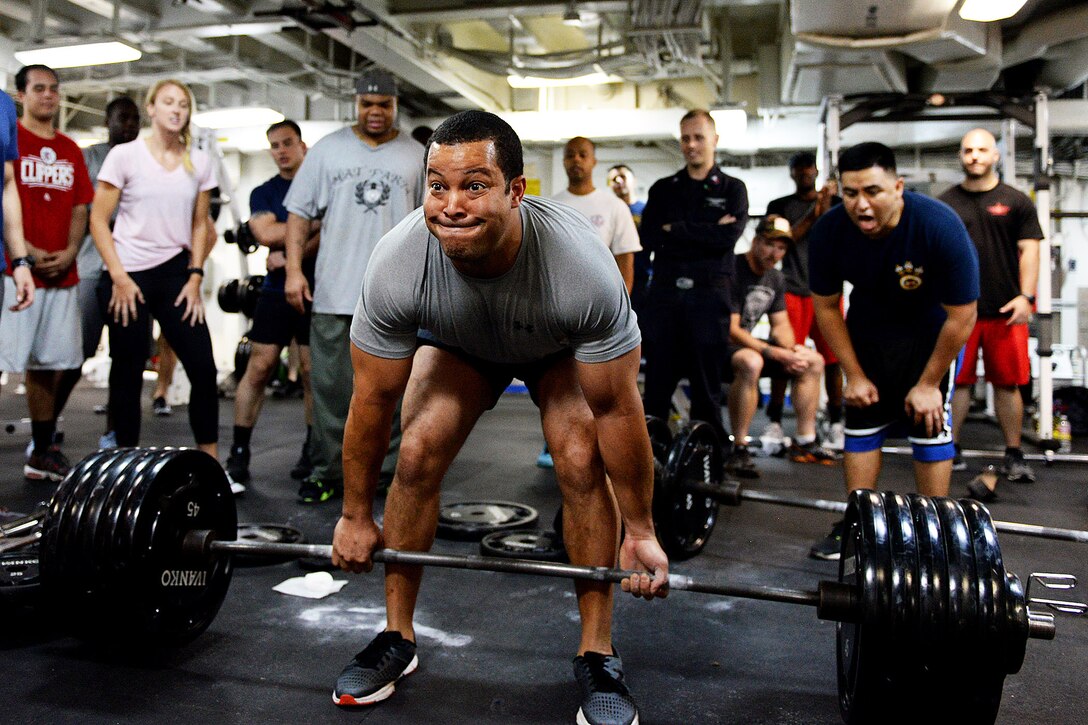 Navy Lt. Cmdr. Michael Blackman lifts 495 pounds during a deadlifting event aboard amphibious assault ship USS Boxer in the Pacific Ocean, Aug. 25, 2016. The Boxer, flag ship for Boxer Amphibious Ready Group, 13th Marine Expeditionary Unit team, is operating in the U.S. 3rd Fleet area of operations.  Navy photo by Petty Officer 1st Class Brian Caracci
