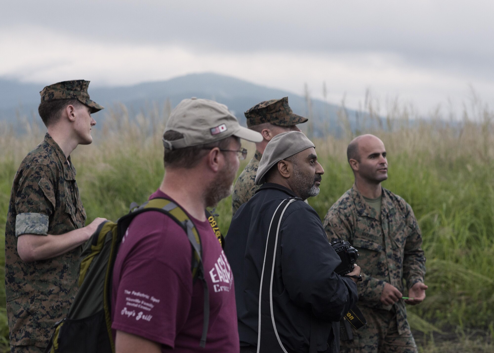 Mark Allen, instructor of the combat photography class, speaks to the importance of safty during a photography class at a training area near Camp Fuji, Japan, Aug. 24, 2016. The photography class offered photography enthusiasts a chance to experience what it is like to take photographs in a combat situation. (U.S. Air Force photo by Airman 1st Class Donald Hudson/Released)