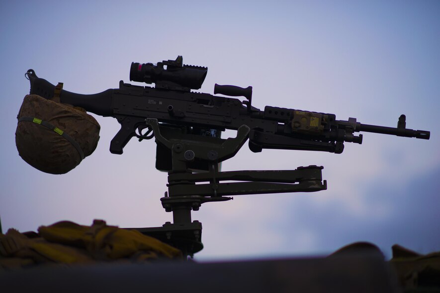 An M240 machine gun sits mounted atop a light-armored vehicle, a resting Marine helmet resting on the handle, during a combat photography class at a training area near Camp Fuji, Japan, Aug. 24, 2016. The M240 machine gun has been used by the United States Armed Forces since 1977. (U.S. Air Force photo by Airman 1st Class Donald Hudson/Released)