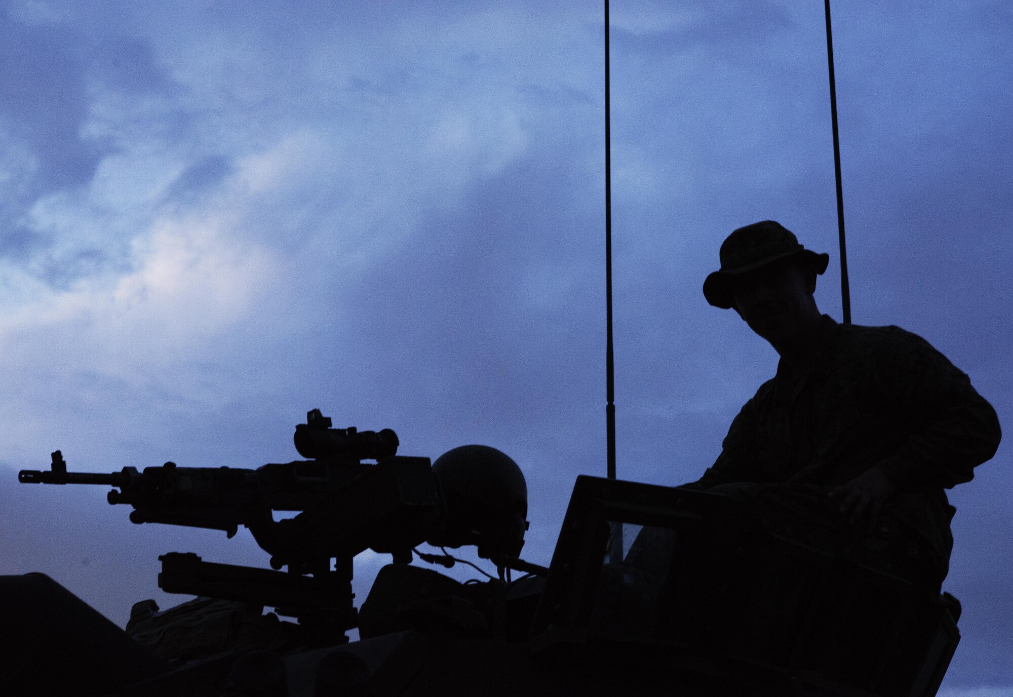 A Marine sits in a turret atop a light-armored vehicle while waiting for the “All Clear” to set up camp for the night at a training area near Camp Fuji, Japan, Aug. 24, 2016. Marines stationed at Camp Fuji conduct regular training exercises to ensure there mobility and mission readiness through various rough terrain. (U.S. Air Force photo by Airman 1st Class Donald Hudson/Released)