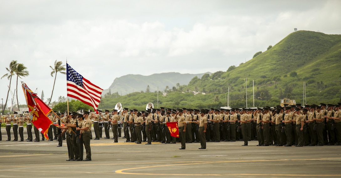U.S. Marines with Headquarters, U.S. Marine Corps Forces, Pacific; MARFORPAC Band; I Marine Expeditionary Force; III Marine Expeditionary Force; U.S. Marine Corps Forces, Korea; and 1st Battalion, 12th Marine Regiment stand at attention during the MARFORPAC change of command ceremony at Marine Corps Base Hawaii, Aug. 26 2016. The change of command ceremony represents the transfer of responsibility and authority between the commanders.  