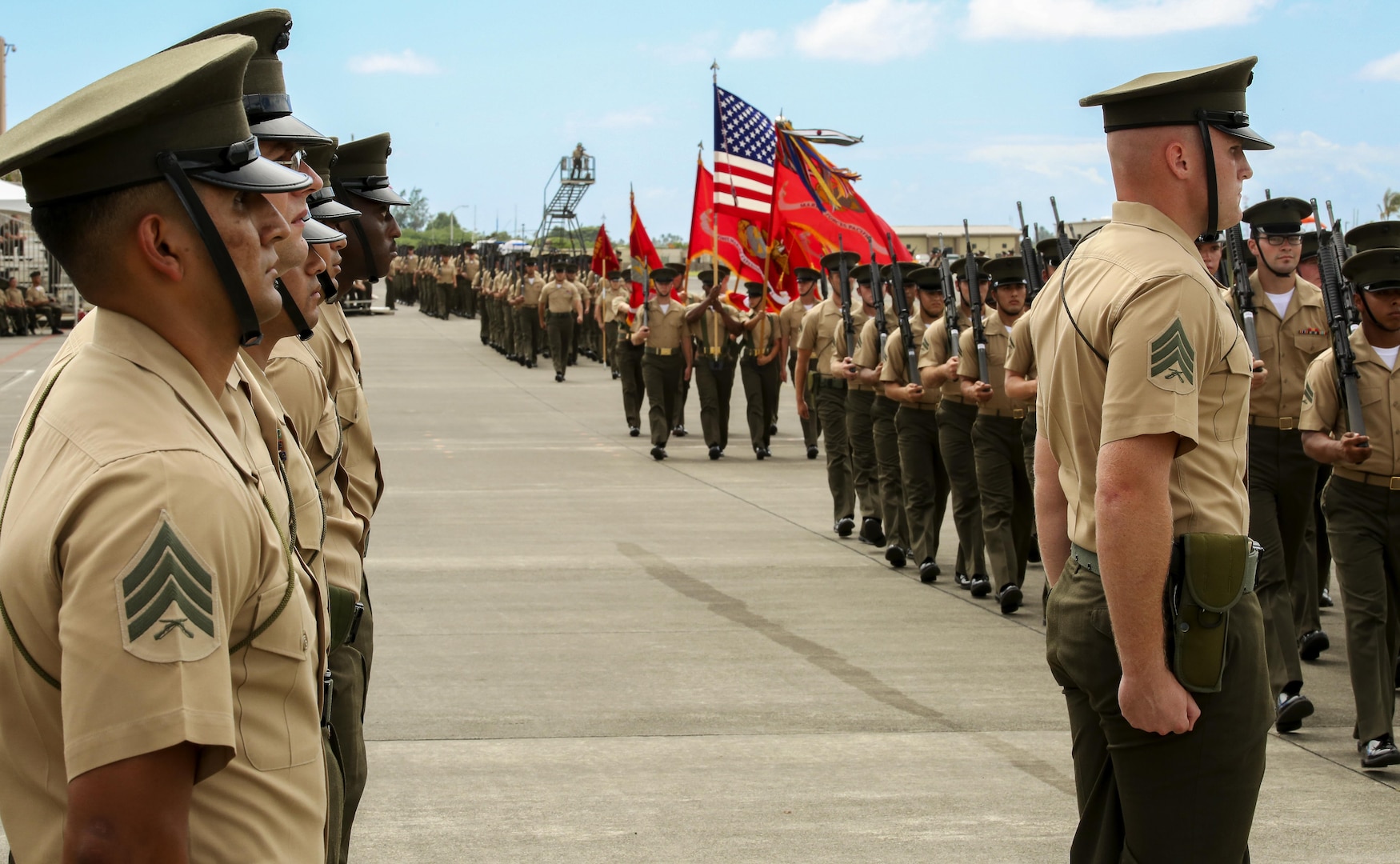 U.S. Marines with U.S. Marine Corps Forces, Pacific conducts a pass in review during the MARFORPAC change of command ceremony at Marine Corps Base Hawaii, Aug. 26, 2016. The change of command ceremony represents the transfer of responsibility and authority over MARFORPAC between commanders.