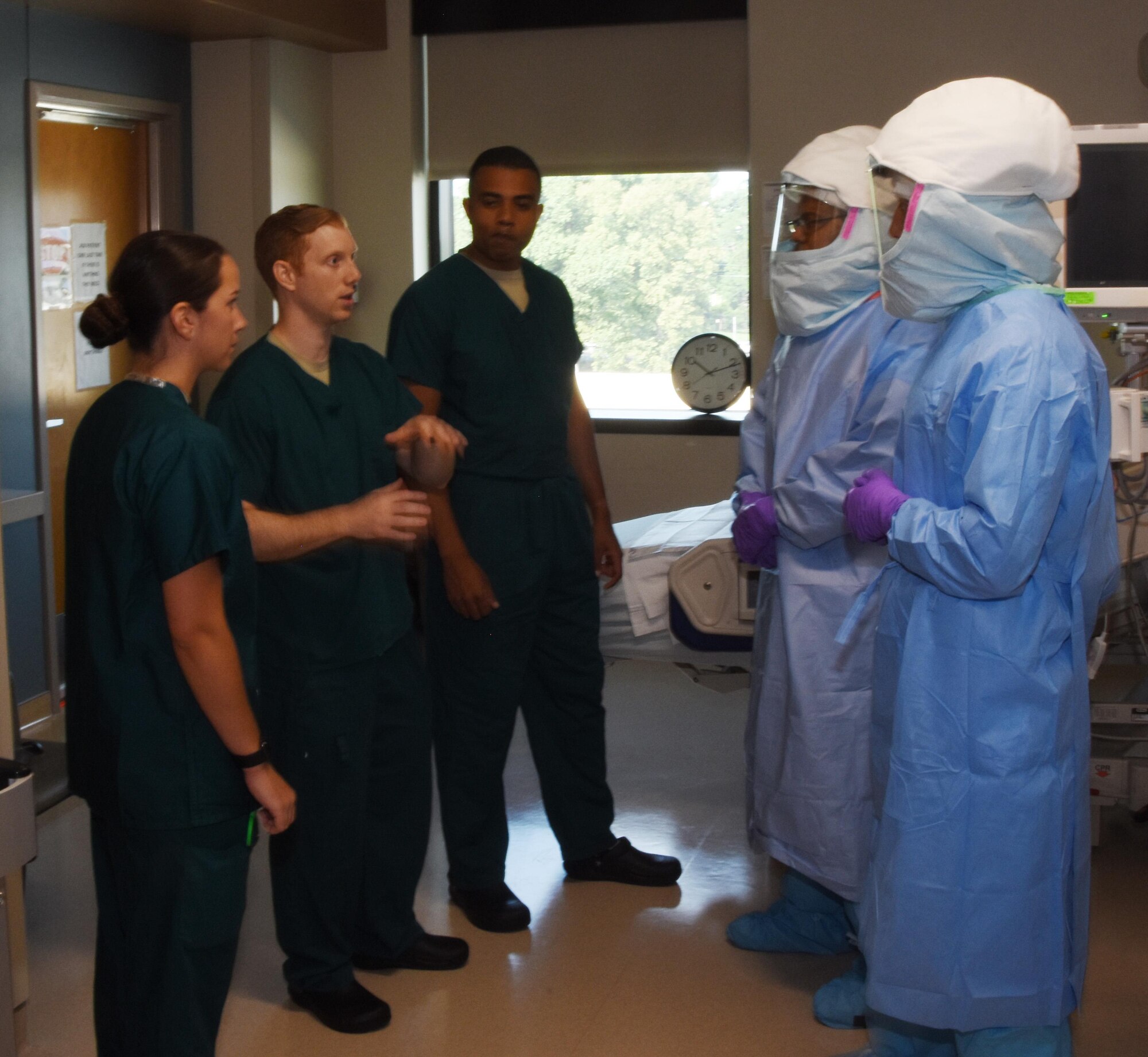 Capt. Patrick Nugent briefs the joint service treatment team on the communications plan prior to the simulated patient arriving at WRNMMC as part of Mobility Solace. (U.S. Air Force photo/ Maj. Rob Sperling) 