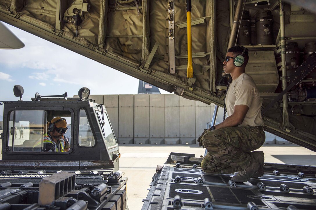 Air Force Staff Sgt. Dallion Richards operates a cargo loader at Bagram Airfield, Afghanistan, Aug. 19, 2016. Richards is a loadmaster assigned to the 774th Expeditionary Airlift Squadron. Aircraft loadmasters are responsible for properly loading, securing and escorting cargo and passengers, and ensuring the plane is properly balanced with the weight of the cargo evenly distributed. Air Force photo by Senior Airman Justyn M. Freeman