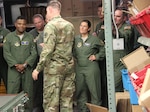 Students in the Advanced Study of Air Mobility Program from USAF Expeditionary Center, Joint Base McGuire-Dix-Lakehurst, N.J. receive a tour of DoD’s largest warehouse from United States Army Lt. Col. Jacob Freeman. 