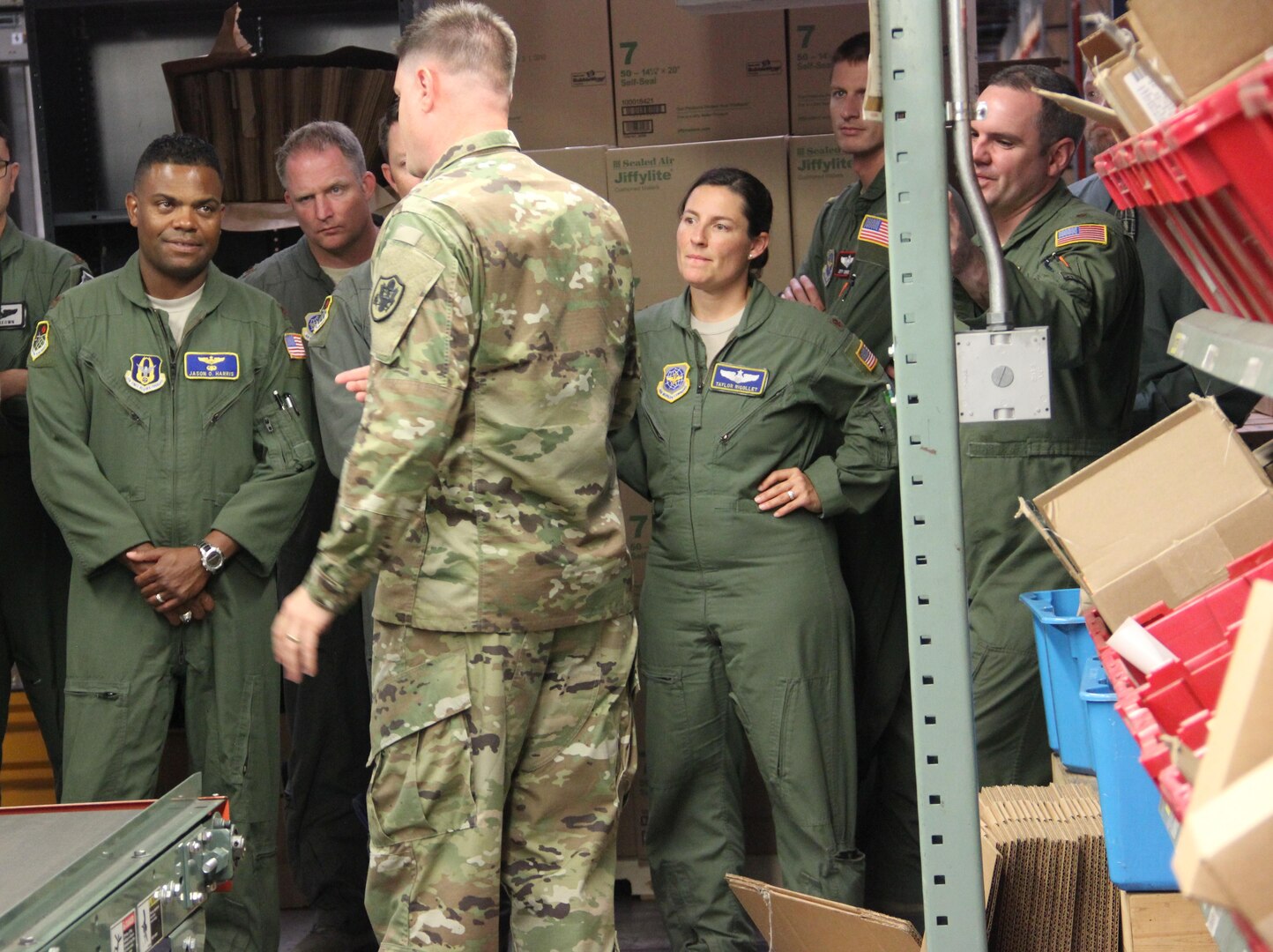 Students in the Advanced Study of Air Mobility Program from USAF Expeditionary Center, Joint Base McGuire-Dix-Lakehurst, N.J. receive a tour of DoD’s largest warehouse from United States Army Lt. Col. Jacob Freeman. 