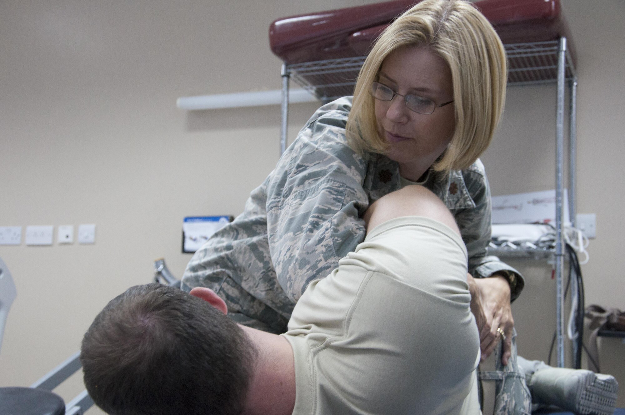 Maj. Kristan Hutchinson, the physical therapy OIC with the 386th Expeditionary Medical Group, performs therapy on a patient Aug. 4, 2016 at undisclosed location in Southwest Asia.(U.S. Air Force photo by Master Sgt. Anika Jones/Released)