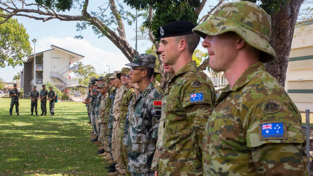 U.S. Marines and soldiers, Australian Army soldiers, and the People’s Liberation Army soldiers stand at attention during Exercise Kowari’s opening ceremony at Larrakeyah Barracks, Northern Territory, Australia, August 26, 2016. The purpose of Exercise Kowari is to enhance the United States, Australia, and China’s friendship and trust, through trilateral cooperation in the Asia-Pacific and Indian Ocean Rim regions.