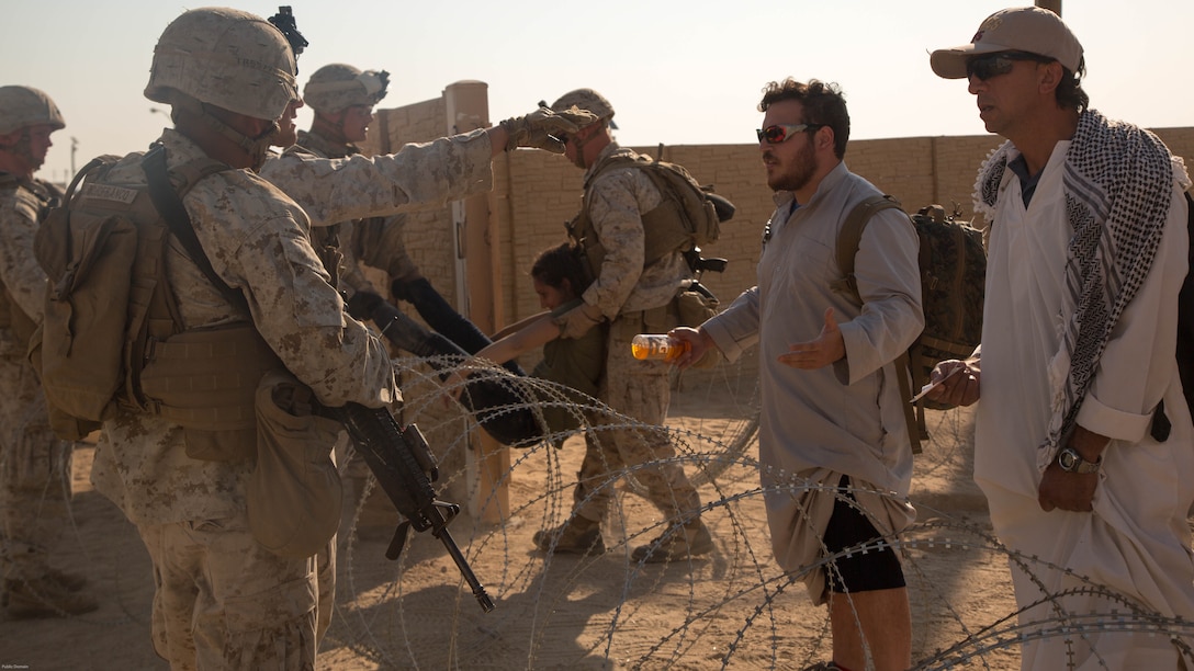Marines with Special Purpose Marine Air Ground Task Force, Crisis Response, Central Command, conduct a non-combatant evacuation operation exercise at Range 220, a military operations on urbanized terrain facility, aboard the Marine Corps Air Ground Combat Center, Twentynine Palms, Calif., Aug. 24, as part of a Certification Exercise.