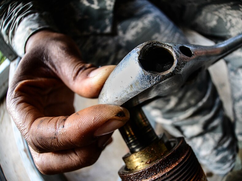 Senior Airman Brittany Parks, 2nd Civil Engineer Squadron heating ventilation and air condition technician, works on a suction line to an HVAC system at Barksdale Air Force Base, La., Aug. 23, 2016. This HVAC system produces cold air to both the iron airman gym and Airman Leadership School. (U.S. Air Force photo/Senior Airman Luke Hill)