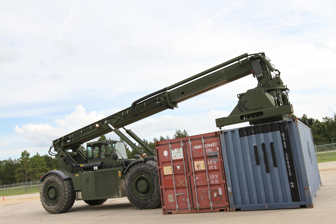 FORT McCOY, WISCONSIN — Engineers with the U.S. Army Reserve’s 86th Training Division manuevers and rearranges CONEX shipping containers while competing in a ‘CONEX Rodeo’ during CSTX 86-16-03 at Ft. McCoy, Wisconsin, August 17, 2016. Safety is the first priority during the CONEX Rodeo, with competitors attempting to re-stack the containers in the least amout of time. CSTX 86-16-03 is the 84th Training Command’s third and final Combat Support Training Exercise of the year (U.S. Army photo by Staff Sgt. Scott Griffin/Released)