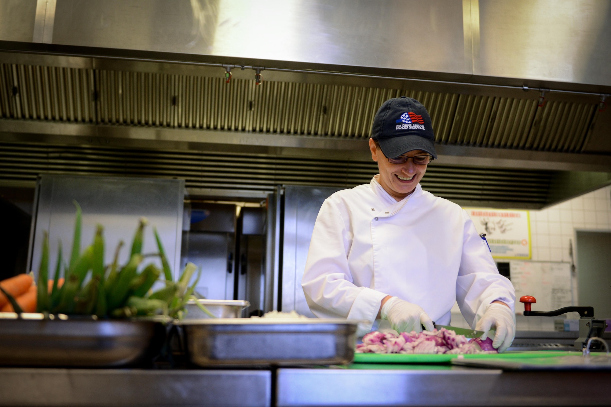 Adina Georgescu, Rheinland Inn dining facility cook, prepares vegetables Aug. 23, 2016, Ramstein Air Base, Germany. The DFAC serves approximately 700 Airmen per day. (U.S. Air Force photo/ Airman 1st Class Joshua Magbanua)