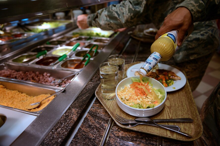 Customers help themselves to the salad bar at the Rheinland Inn dining facility Aug. 23, 2016, Ramstein Air Base, Germany. Besides the salad bar, features of the DFAC include a hot-entrée line, a deli, snack bar and a grill. (U.S. Air Force photo/ Airman 1st Class Joshua Magbanua)