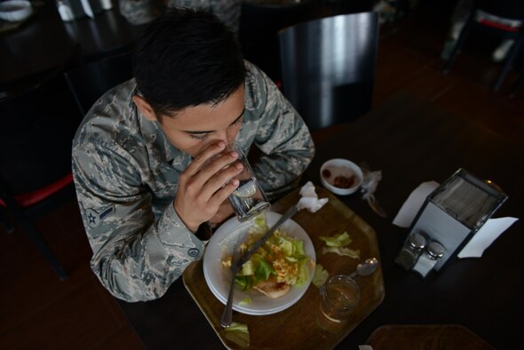 Airman Alfredo Piedrahita, 86th Munitions Squadron tactical air rapid response packages crew member, eats lunch at the Rheinland Inn Dining Facility Aug. 29, 2016, Ramstein Air Base, Germany. Dormitory residents’ meals at the DFAC are paid for in advance. (U.S. Air Force photo/ Airman 1st Class Joshua Magbanua)